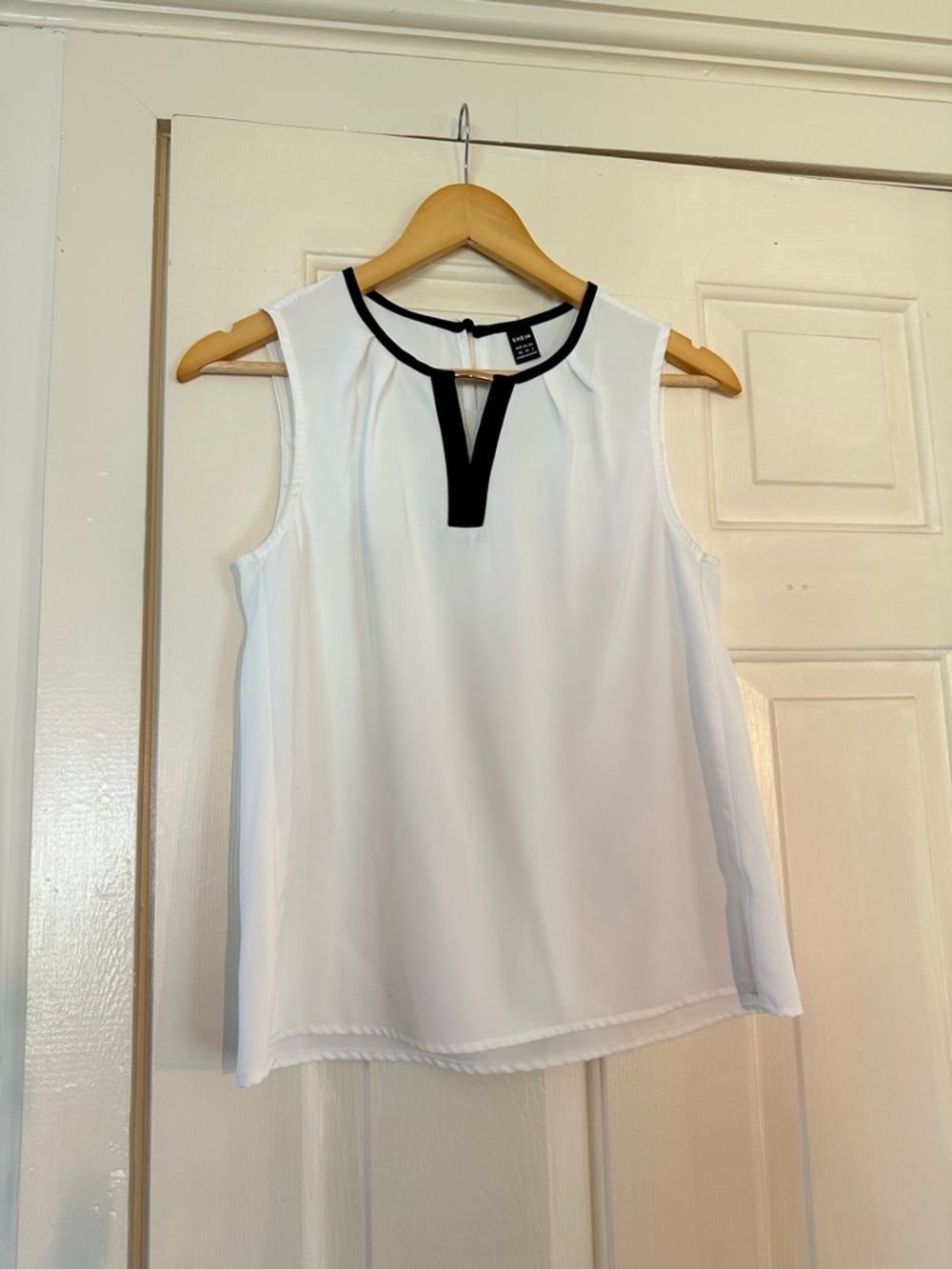 White Sleeveless Keyhole Blouse with Black Trim